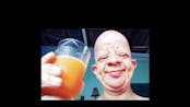 Old man moans after drinking orange juice