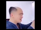Chinese man sings and puts hair on head
