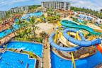 Exterior ambience of water park, outdoors, kids playing 
