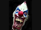 Scary clown laughing