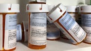 Pill Bottles in Cabinet